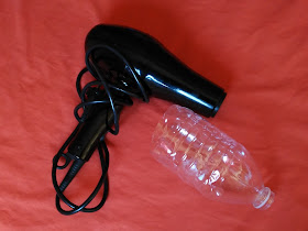 secador con una botella de plastico